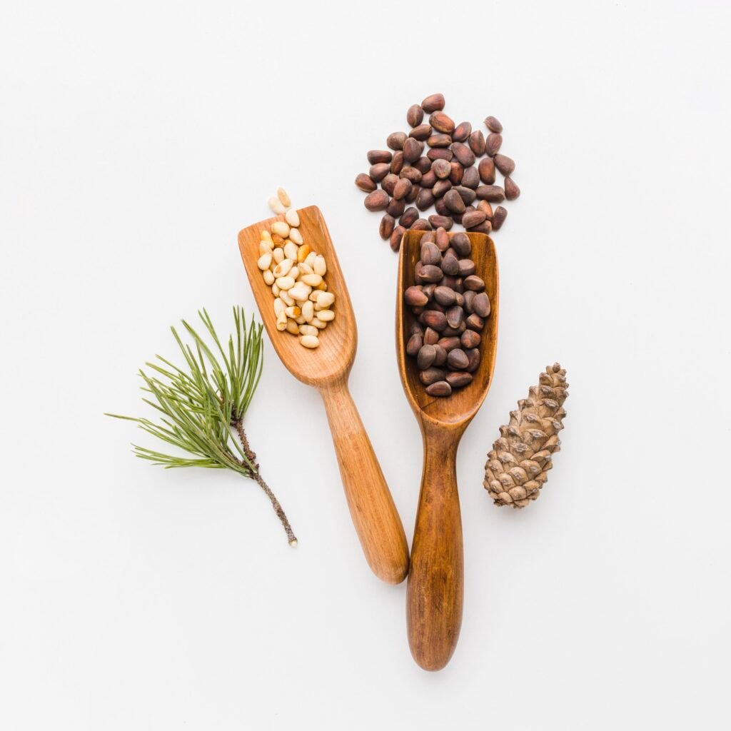 top view pine seeds with wooden spoon